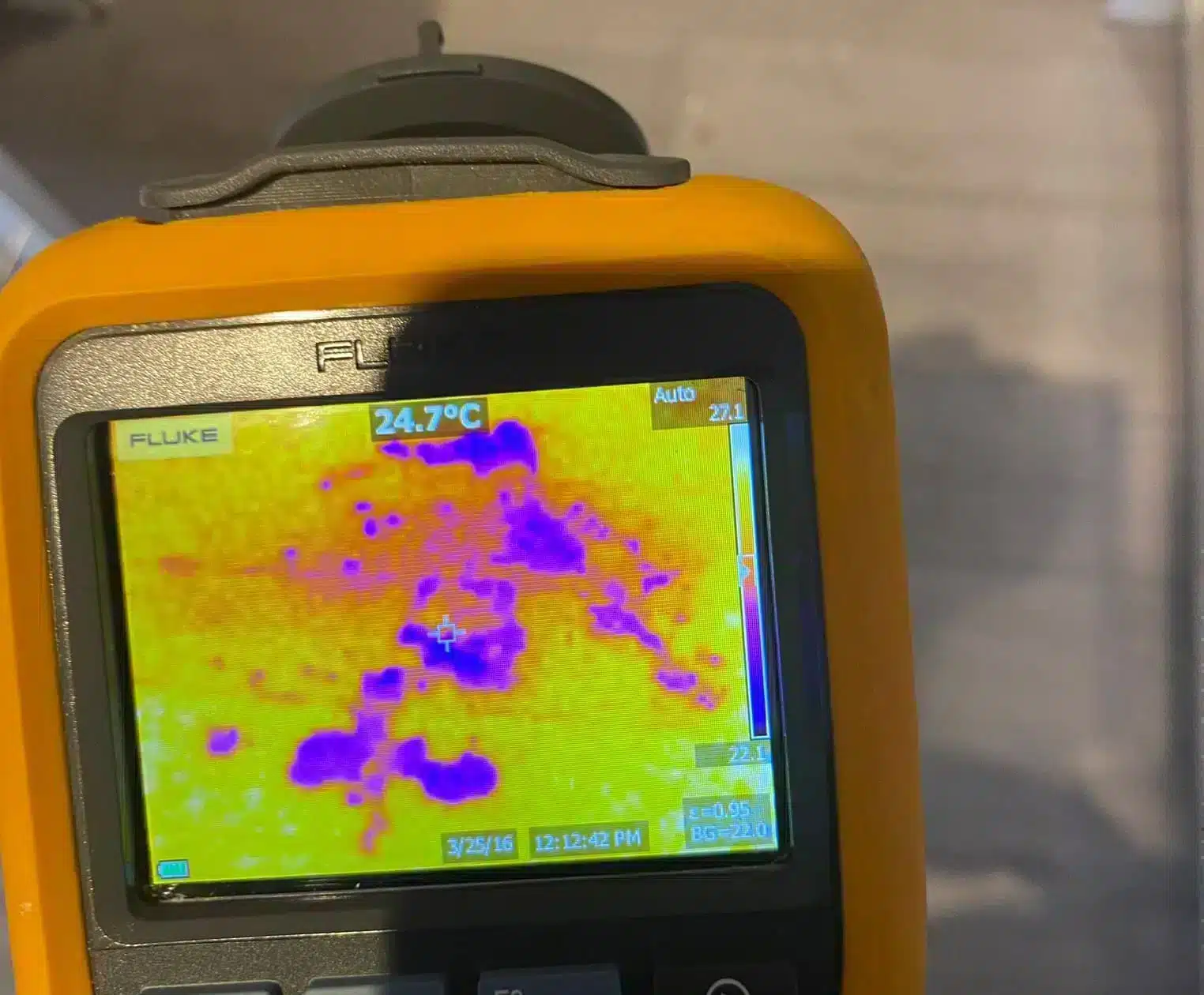 mains water leak detection - engineer scanning a wall with a thermal imaging camera (MCR Leak Detection)
